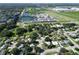 Aerial view of a residential area showing houses, roads, and a large industrial building in the distance at 3422 29Th E St, Bradenton, FL 34208