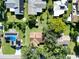 Aerial view of house and surrounding neighborhood with green lawns at 3422 29Th E St, Bradenton, FL 34208