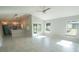 Open living space with tile floors, vaulted ceilings and access to the backyard at 3422 29Th E St, Bradenton, FL 34208