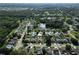 Aerial view of a residential neighborhood with houses and a central lake at 3422 29Th E St, Bradenton, FL 34208