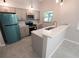 Updated kitchen with stainless steel appliances and a breakfast bar at 3422 29Th E St, Bradenton, FL 34208