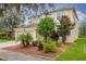 Two-story house with attached garage and manicured landscaping at 10916 Observatory Way, Tampa, FL 33647