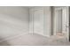 Simple bedroom with carpet and double door closet at 6161 Timberdale Ave, Wesley Chapel, FL 33545