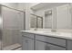 Modern bathroom with double vanity and walk-in shower at 6161 Timberdale Ave, Wesley Chapel, FL 33545