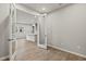 Private office with glass French doors and wood-look flooring at 6161 Timberdale Ave, Wesley Chapel, FL 33545