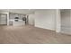Spacious living room with wood-look flooring and an open floor plan at 6161 Timberdale Ave, Wesley Chapel, FL 33545
