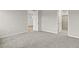 Bright bedroom featuring carpet, and access to bathroom at 6161 Timberdale Ave, Wesley Chapel, FL 33545