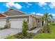 Two-story home with a double garage and landscaped yard at 6161 Timberdale Ave, Wesley Chapel, FL 33545