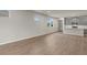 Bright living room featuring wood-look floors and an open concept design at 6161 Timberdale Ave, Wesley Chapel, FL 33545