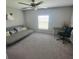 Comfortable bedroom with carpeted floors and a workspace at 14443 Touch Gold Ln, Sun City Center, FL 33573