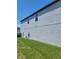 Exterior view of the house showcasing its light gray siding at 14443 Touch Gold Ln, Sun City Center, FL 33573