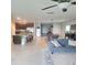 Open kitchen with an island, stainless steel appliances, and a breakfast bar at 14443 Touch Gold Ln, Sun City Center, FL 33573