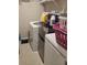 Laundry room with washer, dryer, and extra shelving at 14443 Touch Gold Ln, Sun City Center, FL 33573