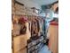 Large walk-in closet with ample hanging space and shelves at 14443 Touch Gold Ln, Sun City Center, FL 33573