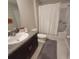 Clean bathroom with granite vanity and tub shower combo at 14443 Touch Gold Ln, Sun City Center, FL 33573