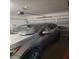Garage with an attached door opener and one car parked at 14443 Touch Gold Ln, Sun City Center, FL 33573
