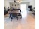 Open dining room with a large table and chairs, and view to the living room at 14443 Touch Gold Ln, Sun City Center, FL 33573