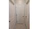 Clean hallway with neutral-colored walls and doors at 14443 Touch Gold Ln, Sun City Center, FL 33573
