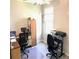 Home office with two workstations and built-in wooden cabinets at 14443 Touch Gold Ln, Sun City Center, FL 33573