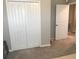 Spacious bedroom closet with double doors and ample storage at 14443 Touch Gold Ln, Sun City Center, FL 33573