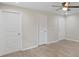 Large bedroom with multiple closets and wood-look flooring at 5206 Five Acre Rd, Plant City, FL 33565