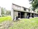 Rear view of townhouses with private screened patios at 8628 Hunters Key Cir, Tampa, FL 33647