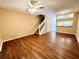 Spacious living room featuring wood-look floors and a ceiling fan at 8628 Hunters Key Cir, Tampa, FL 33647