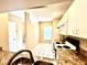 Cozy kitchen with granite countertops and white cabinetry at 8628 Hunters Key Cir, Tampa, FL 33647