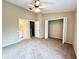 Spacious bedroom with a ceiling fan and large closet at 8628 Hunters Key Cir, Tampa, FL 33647