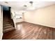 Open living area with laminate floors and staircase at 8628 Hunters Key Cir, Tampa, FL 33647