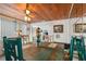 Bright dining room with wood table and ceiling, offering a view into the living room at 5817 11Th S Ave, Gulfport, FL 33707