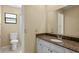 Clean bathroom with granite countertop and single sink vanity at 9506 Pebble Glen Ave, Tampa, FL 33647