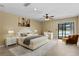 Spacious main bedroom with pool view and ensuite bathroom at 9506 Pebble Glen Ave, Tampa, FL 33647