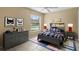 Charming bedroom with gray dresser, twin bed, and Batman decor at 9506 Pebble Glen Ave, Tampa, FL 33647