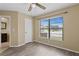Bright bedroom with wood-look flooring and window with a view at 9506 Pebble Glen Ave, Tampa, FL 33647