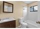 Clean bathroom with a tub, toilet and vanity at 9506 Pebble Glen Ave, Tampa, FL 33647