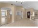 Living room with vaulted ceilings and tile flooring at 9506 Pebble Glen Ave, Tampa, FL 33647