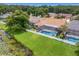 Home boasts a private screened pool and spa at 9506 Pebble Glen Ave, Tampa, FL 33647