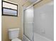 Simple bathroom with shower/tub combo and small window at 9506 Pebble Glen Ave, Tampa, FL 33647