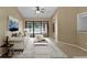 Living room with a comfortable sofa and view of the pool at 9506 Pebble Glen Ave, Tampa, FL 33647