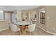 Bright dining area with a round table and four chairs at 9506 Pebble Glen Ave, Tampa, FL 33647