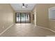 Gathering room with sliding glass doors opening to a pool view at 9506 Pebble Glen Ave, Tampa, FL 33647