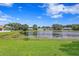 Peaceful lake view, showcasing a picturesque community setting at 9506 Pebble Glen Ave, Tampa, FL 33647