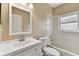 Simple bathroom with a bathtub, toilet, and white vanity at 5321 Silver Charm Ter, Wesley Chapel, FL 33544