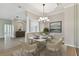 Formal dining room with chandelier and modern decor at 5321 Silver Charm Ter, Wesley Chapel, FL 33544