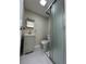 Bathroom with gray vanity, toilet and walk in shower at 2120 Hess Dr, Holiday, FL 34691