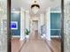 Grand entryway with hardwood floors, crystal chandelier, and a built-in fish tank at 2501 N Dundee St, Tampa, FL 33629