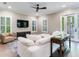 Spacious living room with sectional sofa and access to patio at 2501 N Dundee St, Tampa, FL 33629