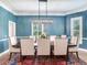 Elegant dining room with large table, chandelier, and plenty of natural light at 2501 N Dundee St, Tampa, FL 33629