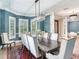 Formal dining room with a large table and matching chairs, and a decorative area rug at 2501 N Dundee St, Tampa, FL 33629